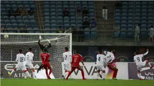  ?? AFP ?? Bahrain’sAli Jaafar Mohamed Madan (right) scores an own goal during the 2017 Gulf Cup of Nations semi-final match against Oman at the Sheikh Jaber Al Ahmad Stadium in Kuwait City. —