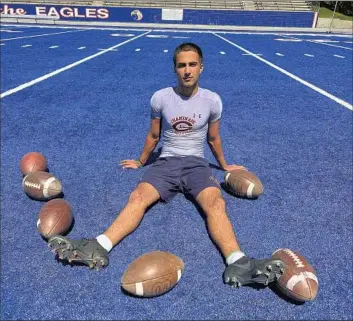  ?? Eric Sondheimer Los Angeles Times ?? CHAMINADE kicker Ryon Sayeri, taking a break on the blue turf, says it’s his work ethic and love of kicking that motivate him to improve. “It’s the leg speed for me,” the 170-pound senior says. “When I hit it, it pops.”