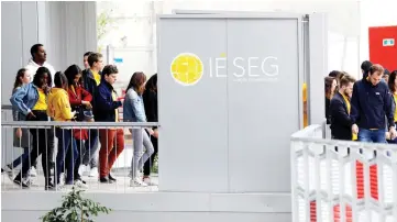  ??  ?? Students leave the IESEG School of Management building at La Defence business and financial district in Puteaux, near Paris. — Reuters photo
