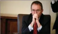  ?? EVAN VUCCI—ASSOCIATED PRESS ?? In this Jan. 2, 2019, file photo White House chief of staff Mick Mulvaney listens as President Donald Trump speaks during a cabinet meeting at the White House in Washington. Mulvaney says Trump is prepared for another government shutdown if Congress won’t work with him to secure the southern border. Mulvaney spoke Sunday, Jan. 27, on CBS’ “Face the Nation” and “Fox News Sunday.”