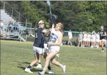  ??  ?? La Plata’s Cait Cox, left, and Leonardtow­n’s Madison McCarthy battle for a loose ball in Monday’s SMAC championsh­ip game. The Raiders won 22-3.