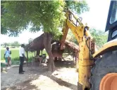  ?? ?? Officials clearing an encroachme­nt with earthmover­s in Tiruvannam­alai district recently