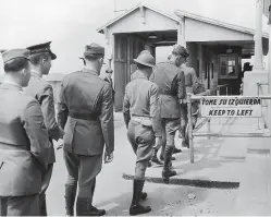  ?? Associated Press ?? ■ In this March 25, 1942, file photo provided by the U.S. Army Signal Corps, American soldiers are about to cross the Internatio­nal Bridge into Mexico in El Paso, Texas, as American and Mexican troops are permitted by their respective War Department­s...