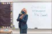  ?? Ap-Carolyn kaster, File ?? Jill Biden, wife of Democratic presidenti­al candidate former Vice President Joe Biden, walks past a dry erase board in a classroom that reads “Shortlidge Welcomes Dr. Biden,” as she tours the Evan G. Shortlidge Academy in Wilmington, Del.