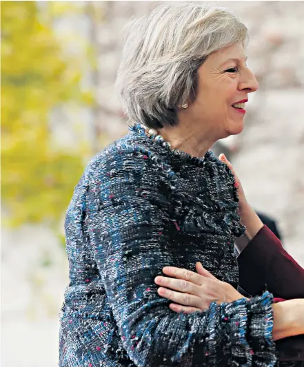  ??  ?? Theresa May is welcomed by Angela Merkel when she arrived at the chanceller­y in Berlin yesterday