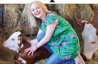  ??  ?? HIGH STANDARDS: Internatio­nal Trade Secretary Liz Truss meets Hereford cattle during farm visit in 2019