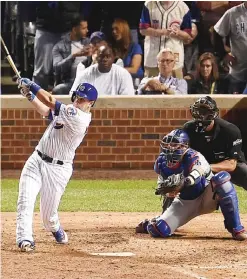  ?? — AFP ?? CHICAGO: Miguel Montero #47 of the Chicago Cubs hits a grand slam home run in the eighth inning against the Los Angeles Dodgers during game one of the National League Championsh­ip Series at Wrigley Field on Saturday in Chicago, Illinois.