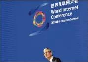  ?? CHINATOPIX / VIA ASSOCIATED PRESS ?? Apple CEO Tim Cook speaks Sunday to the opening ceremony of the Fourth World Internet Conference in Wuzhen, China. This is the first time Apple has attended the state-run conference.