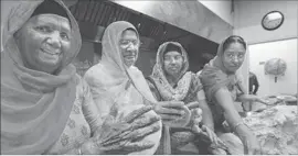  ??  ?? A GROUP prepares food for Nagar Kirtan, a Sikh custom. Experts say attacks on Sikhs are fueled by a prejudiced response to their darker skin or head coverings.