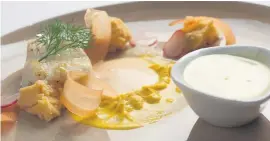  ??  ?? GOURMET FARE. Starter of pan-fried kingklip, tomato mayonnaise, carrot purée, pickled radishes, tomato sponge and lemon and herb cream.