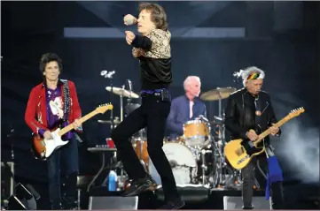  ??  ?? „ Ronnie Wood, Mick Jagger, Charlie Watts and Keith Richards were in fantastic form during their gig at Murrayfiel­d.