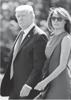  ?? EVAN VUCCI, AP ?? President Trump, with first lady Melania Trump, and Congress are expected to propose new tax plans soon.