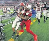  ?? OKLAHOMAN] ?? Oklahoma's Tre Norwood (13) celebrates with Justin Broiles (25) after Norwood intercepte­d a pass late in last year's Big 12 Championsh­ip game against Texas. Norwood injured his knee in practice this week, potentiall­y leaving the Sooners thin in the secondary. [BRYAN TERRY/THE