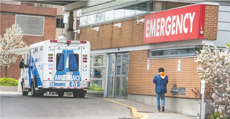  ?? Peter J Thompson / Postmedia News ?? A man walks outside of Toronto Western Hospital Friday. Many hospitals have seen fewer non- COVID cases as “elective” surgeries are delayed and the sick avoid treatment.