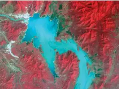  ?? (NASA/METI/AIST/Japan Space Systems, and US/Japan ASTER Science Team/Reuters) ?? THE BLUE NILE River fills the Grand Ethiopian Renaissanc­e Dam reservoir near the Ethiopia-Sudan border, in a broad spectral image from November.