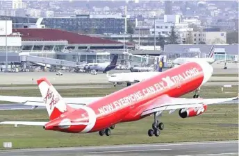  ??  ?? AirAsia’s integrated efforts to monetise its assets, via digitaliza­tion is strategic, as it takes advantage of its passengers’ database to enhance customer experience and improve ancillary incomes. — Bernama photo