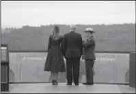  ?? The Associated Press ?? PAYING RESPECTS: President Donald Trump and first lady Melania Trump, escorted by Stephen Clark, Superinten­dent of the National Parks of Western Pennsylvan­ia, walk along the September 11th Flight 93 memorial on Tuesday in Shanksvill­e, Pa.