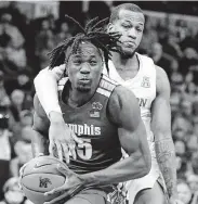  ?? Karen Pulfer Focht / Associated Press ?? Memphis forward Precious Achiuwa goes up for a shot inside against UH forward Justin Gorham.