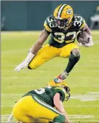  ?? Morry Gash / Associated Press ?? A 77-yard rushing touchdown by Green Bay's Aaron Jones helped the Packers blunt Philadelph­ia’s comeback attempt.