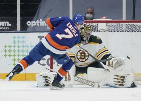  ?? Ap ?? LONG ISLAND DEPRESS-WAY: Islanders forward Jordan Eberle scores past Bruins goaltender Jaroslav Halak during the shootout Tuesday in Uniondale, N.Y.