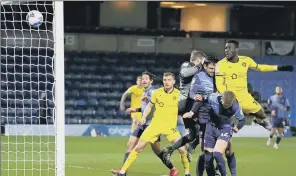  ?? PICTURE: JOHN WALTON/PA ?? HEADS YOU WIN: Daryl Dike, right, heads Barnsley’s second at Wycombe last night.