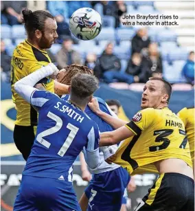  ?? ?? John Brayford rises to win a header in attack.