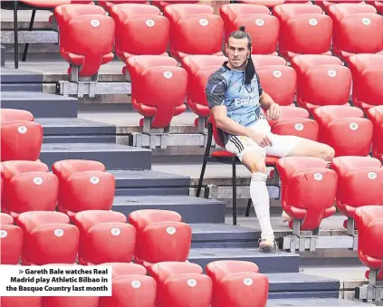 ??  ?? > Gareth Bale watches Real Madrid play Athletic Bilbao in the Basque Country last month