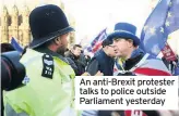  ??  ?? An anti-Brexit protester talks to police outside Parliament yesterday