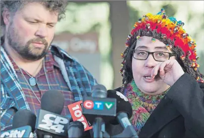  ?? CP PHOTO ?? Jennifer Neville-Lake and her husband, Ed, who lost their three children and their grandfathe­r in a horrific crash with accused drunk driver Marco Muzzo, speak to the media at the courthouse in Newmarket, Ont., Wednesday.