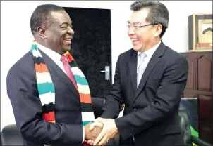  ?? (Picture by John Manzongo) ?? President Mnangagwa welcomes outgoing Chinese Ambassador to Zimbabwe Mr Huang Ping at his Munhumutap­a offices in Harare yesterday. —