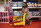  ?? ?? Eve Gancia, four, stocks up on merch in Dublin at the height of the Frozen craze in the mid-10s. Photograph: PA /Alamy