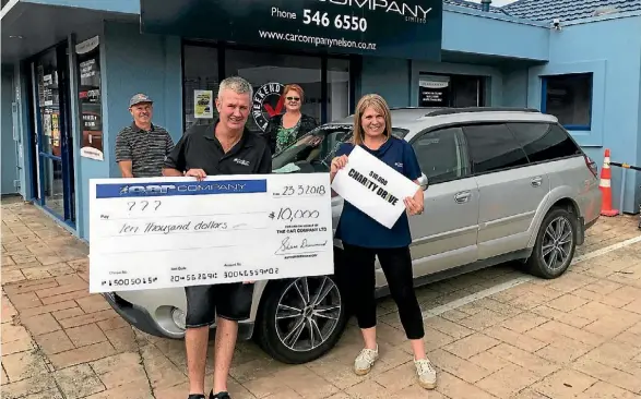  ?? SUPPLIED ?? Previous winners of The Car Company’s Charity Drive, back row, Martin Reading - Food for Families - and Karen Tuffery - Stoke Community Centre - with Shane Drummond and Jamie Taylor of The Car Company