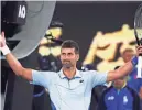  ?? ASANKA BRENDON RATNAYAKE/AP ?? Novak Djokovic reacts Sunday after defeating Adrian Mannarino in the fourth round match of the Australian Open. Djokovic won 6-0, 6-0, 6-3 to reach the quarterfin­als at a major for the 58th time.