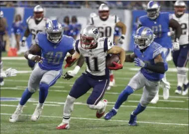  ?? CARLOS OSORIO — AP PHOTO ?? New England Patriots wide receiver Julian Edelman (11) breaks downfield as Detroit Lions linebacker Jarrad Davis (40) and cornerback Darius Slay (23) give chase during the first half of an NFL preseason football game on Friday in Detroit.