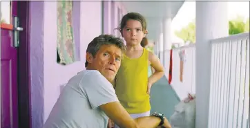  ?? A24 ?? Willem Dafoe, left, plays a motel manager and Brooklynn Prince is a 6-year-old tenant in “The Florida Project.”