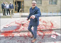  ?? ?? RED ALL OVER: Scott LoBaido makes a pretend crime scene — including a pink jacket like the one of a recently shot Bronx baby — outside Manhattan DA Alvin Bragg’s office Tuesday.