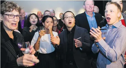  ?? BEN NELMS/SPECIAL TO POSTMEDIA ?? NPA candidate Hector Bremner’s supporters watch the byelection results come in Vancouver Saturday night. Bremner won a city council seat with close to 28 per cent of the vote.
