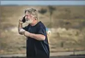  ?? Jim Weber Santa Fe New Mexican ?? ACTOR Alec Baldwin talks on the phone after being questioned in the shooting in Santa Fe, N.M., in 2021.