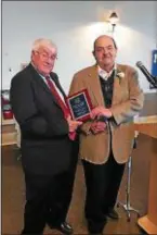  ?? CONTRIBUTE­D PHOTO ?? Longtime Trentonian sportswrit­er George O’Gorman, right, is presented with his plaque upon his induction into the Mercer County Basketball Hall of Fame by his cousin Joe, left, at the inaugural dinner on Sunday.