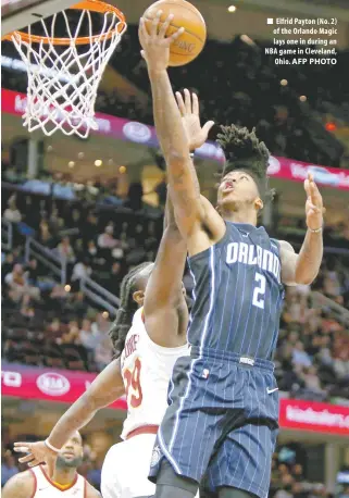  ?? AFP PHOTO ?? Elfrid Payton ( No. 2) of the Orlando Magic lays one in during an NBA game in Cleveland, Ohio.