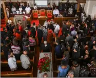  ?? JAHI CHIKWENDIU — WASHINGTON POST VIA AP ?? Mourners follow Derrick Fudge’s casket out of the church at the end of the funeral. Fudge’s son Dion Green blamed hate for his father’s death in last week’s shooting.