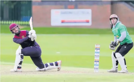  ??  ?? Porthill Park’s John Hancock hits a boundary in his side’s victory over Burslem at the weekend.
Pic: Terry Lawson