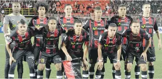  ?? EZEQUIEL BECERRA/AFP/GETTY IMAGES ?? Liga Deportiva Alajuelens­e team players pose before their CONCACAF Champions League semifinal match against the Impact at Alejandro Morera Soto stadium in Alajuela on April 7.