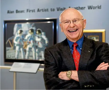  ?? AP ?? Alan Bean, above left, with fellow Apollo 12 astronauts Richard Gordon, centre, and Charles Conrad in September 1969. Left, at a preview of his artwork in Austin, Texas, in 2008.