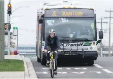  ?? DARREN STONE, TIMES COLONIST ?? A transit bus and a bike share the southbound bus-bike lane on Douglas Street, near Burnside Road East.