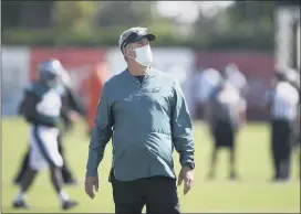  ?? TIM TAI — THE ASSOCIATED PRESS ?? Masked Eagles head coach Doug Pederson is overseeing more a work in progress right now as the Eagles’ weirdest camp starts winding down.