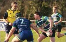  ??  ?? Kevin Browne delivering a pass for Gorey as Tom Sexton (2) looks on.