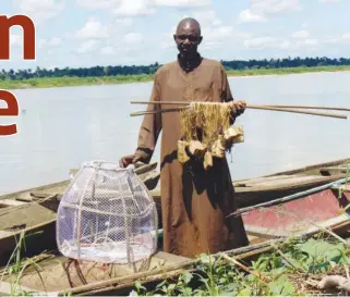  ??  ?? A man holds common fishing equipment at Odi in Bayelsa State.