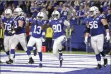  ?? MICHAEL CONROY — THE ASSOCIATED PRESS ?? Colts wide receiver Chester Rogers (80) celebrates his game-winning touchdown with T.Y. Hilton (13) against the Giants during the second half.