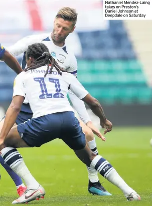  ??  ?? Nathaniel Mendez-Laing takes on Preston’s Daniel Johnson at Deepdale on Saturday